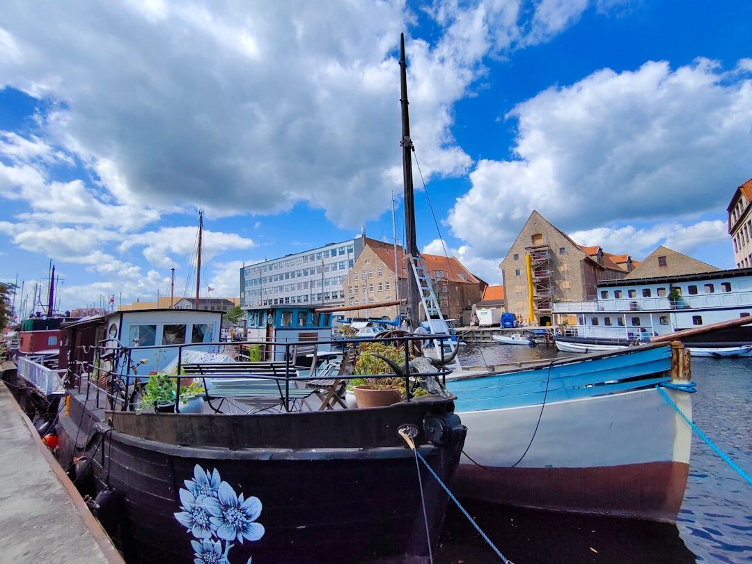Wooden fishing boats moored in a small Danish harbour