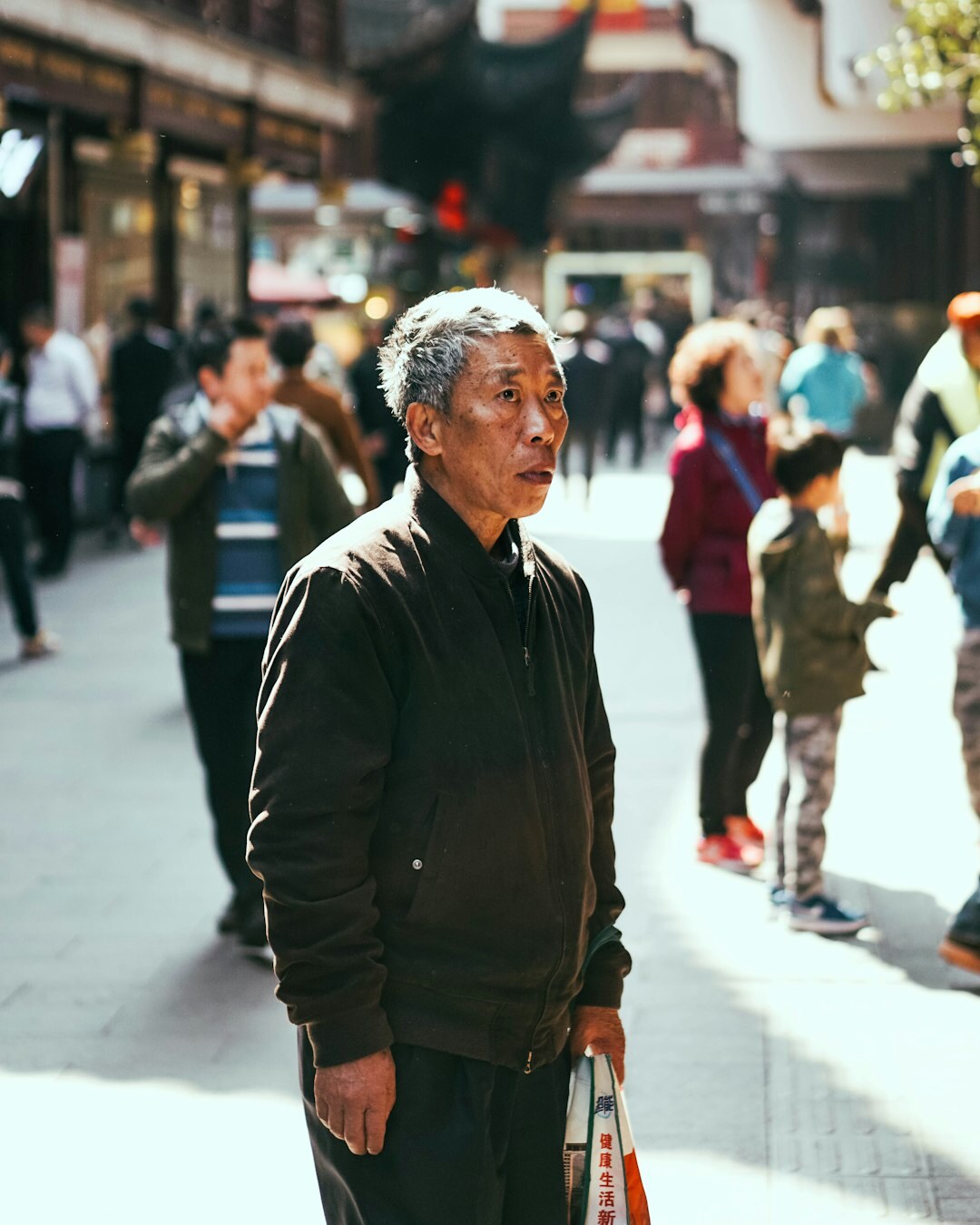 elderly man talking on street