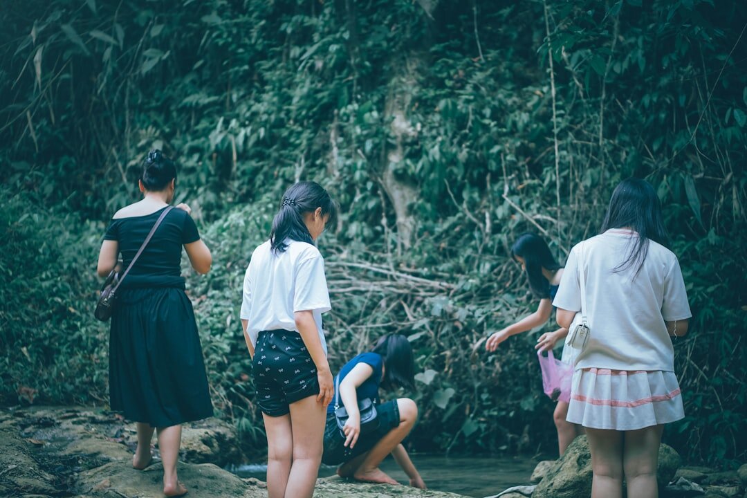 teacher with children in forest