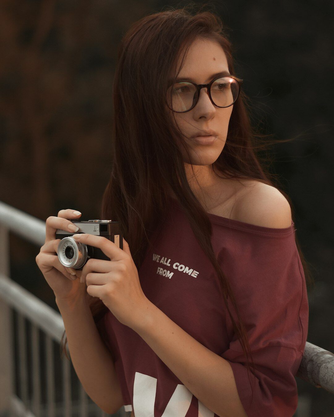 Danish male documentary photographer holding a camera outdoors
